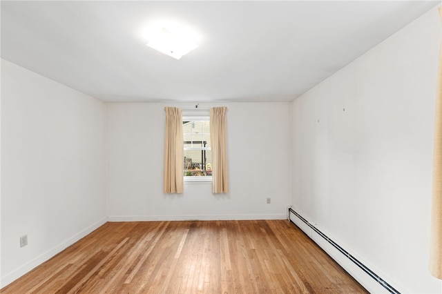 15 Rutland St, Warwick, RI 02888 - spare room featuring a baseboard heating unit and light wood finished floors