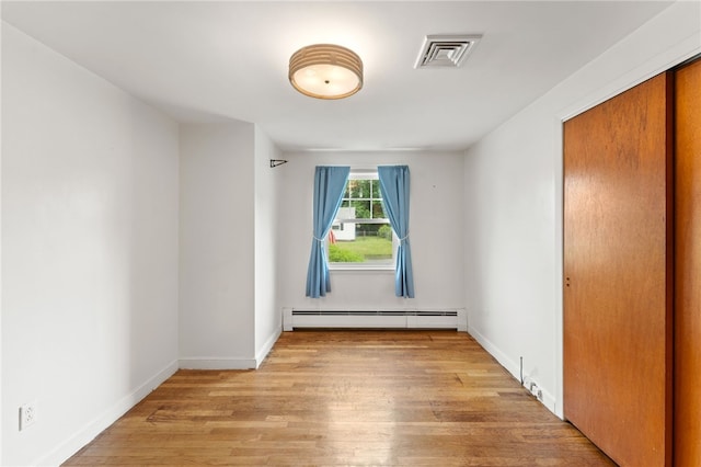 15 Rutland St, Warwick, RI 02888 - unfurnished room featuring baseboard heating and light wood-style floors