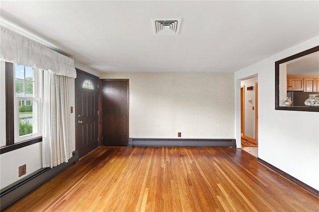 15 Rutland St, Warwick, RI 02888 - spare room featuring a baseboard radiator and light wood-style floors