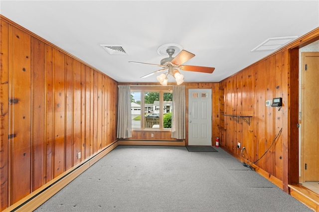 15 Rutland St, Warwick, RI 02888 - carpeted spare room featuring wood walls, a baseboard radiator, ceiling fan, and ornamental molding