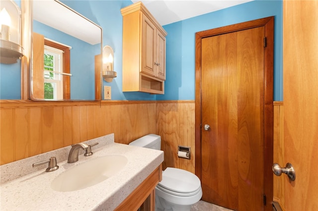 15 Rutland St, Warwick, RI 02888 - bathroom with wainscoting, vanity, and wooden walls