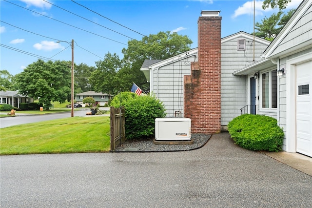 15 Rutland St, Warwick, RI 02888 - view of side of property with a chimney and a lawn