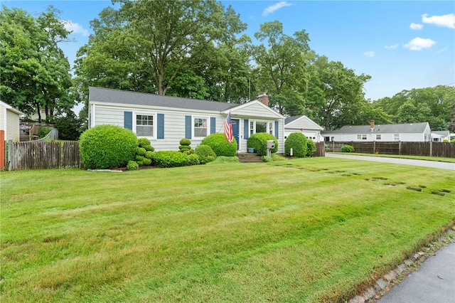 15 Rutland St, Warwick, RI 02888 - view of front of property with a chimney and a garage