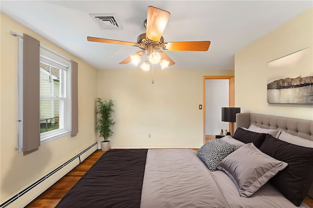 15 Rutland St, Warwick, RI 02888 - bedroom featuring a baseboard radiator, dark wood finished floors, and ceiling fan