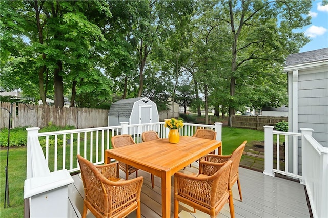 15 Rutland St, Warwick, RI 02888 - wooden deck with outdoor dining space, a storage unit, and a fenced backyard