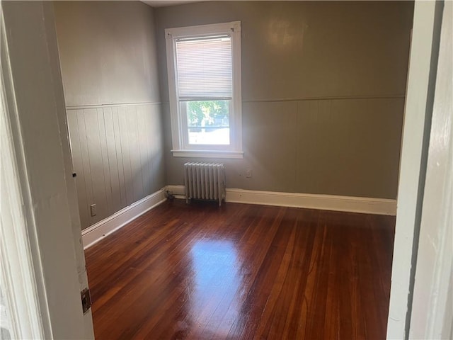 64 Elmdale Ave, Providence, RI 02909 - spare room featuring radiator, wood finished floors, and wainscoting
