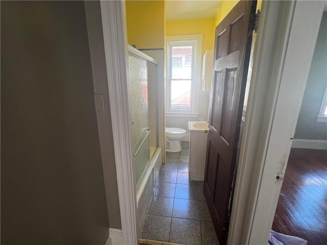 64 Elmdale Ave, Providence, RI 02909 - bathroom with tile walls and shower / bath combination with glass door