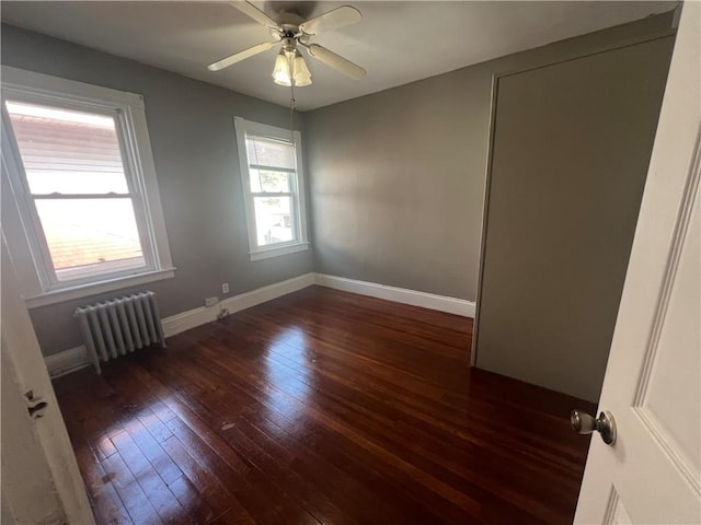 64 Elmdale Ave, Providence, RI 02909 - spare room with radiator, hardwood / wood-style flooring, and a ceiling fan