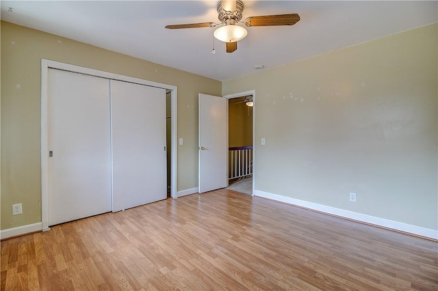 400 Narragansett Pkwy Unit Ei 2, Warwick, RI 02888 - unfurnished bedroom featuring light wood-style floors, a closet, and ceiling fan