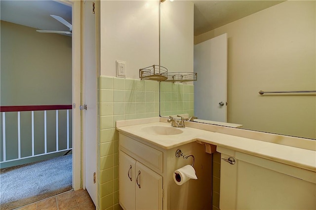 400 Narragansett Pkwy Unit Ei 2, Warwick, RI 02888 - half bathroom with vanity, tile patterned floors, a ceiling fan, tile walls, and wainscoting