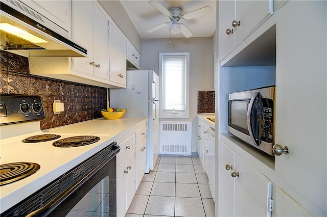 400 Narragansett Pkwy Unit Ei 2, Warwick, RI 02888 - kitchen featuring range with electric stovetop, stainless steel microwave, under cabinet range hood, ceiling fan, and radiator