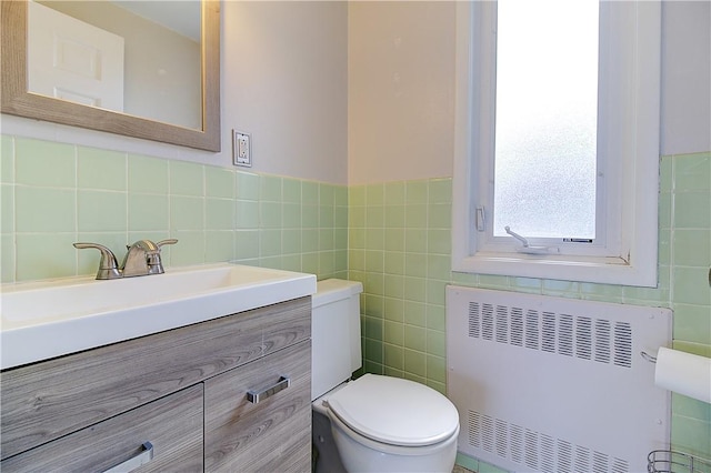 400 Narragansett Pkwy Unit Ei 2, Warwick, RI 02888 - half bathroom with tile walls, radiator heating unit, and vanity