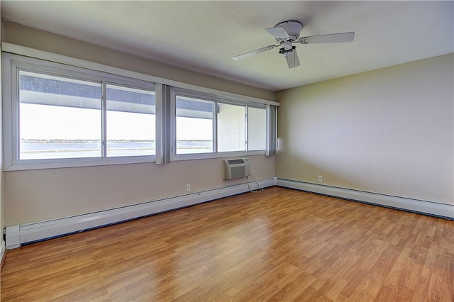 400 Narragansett Pkwy Unit Ei 2, Warwick, RI 02888 - unfurnished room featuring baseboard heating, light wood-style flooring, ceiling fan, and a wall mounted AC