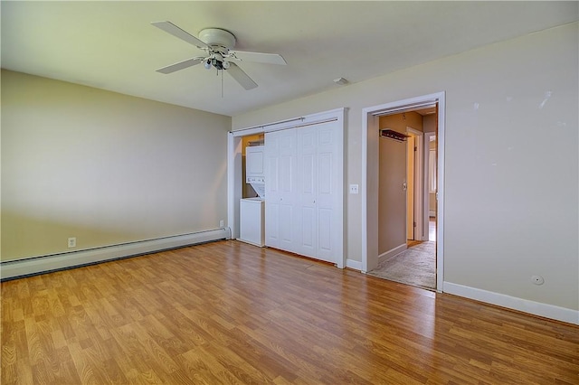400 Narragansett Pkwy Unit Ei 2, Warwick, RI 02888 - unfurnished bedroom with baseboard heating, light wood-type flooring, a closet, and ceiling fan