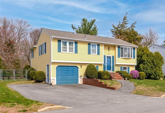 132 Elton Cir, Cranston, RI 02921 - raised ranch featuring driveway and an attached garage