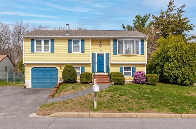 132 Elton Cir, Cranston, RI 02921 - raised ranch featuring a garage and driveway