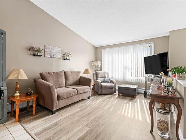 132 Elton Cir, Cranston, RI 02921 - living area with vaulted ceiling, light wood-style flooring, and baseboard heating