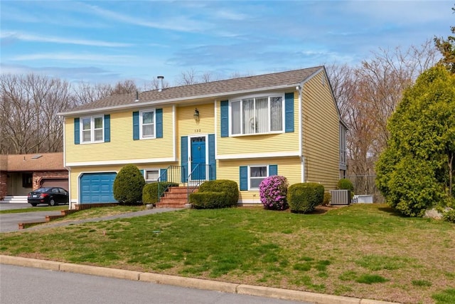 132 Elton Cir, Cranston, RI 02921 - split foyer home with a garage, a front lawn, and driveway