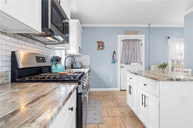 229 Roger Williams Ave, East Providence, RI 02916 - kitchen with stainless steel appliances, ornamental molding, decorative backsplash, white cabinetry, and light stone counters