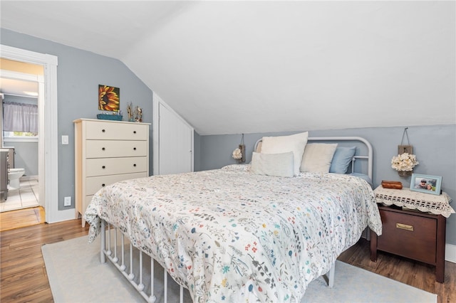229 Roger Williams Ave, East Providence, RI 02916 - bedroom featuring wood finished floors and vaulted ceiling