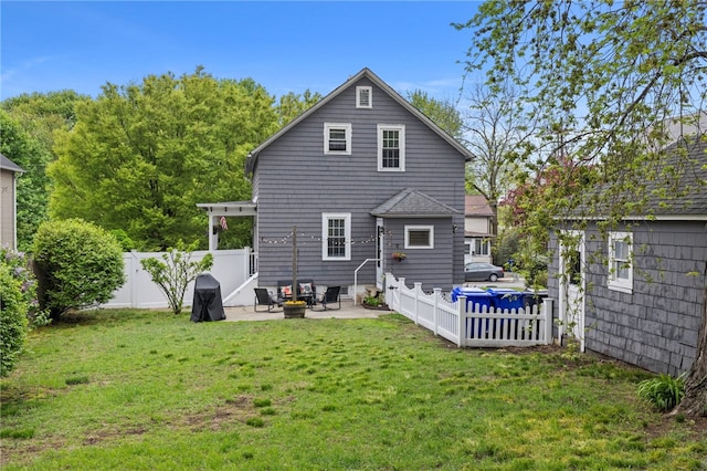 229 Roger Williams Ave, East Providence, RI 02916 - back of property featuring a patio area and a fenced backyard