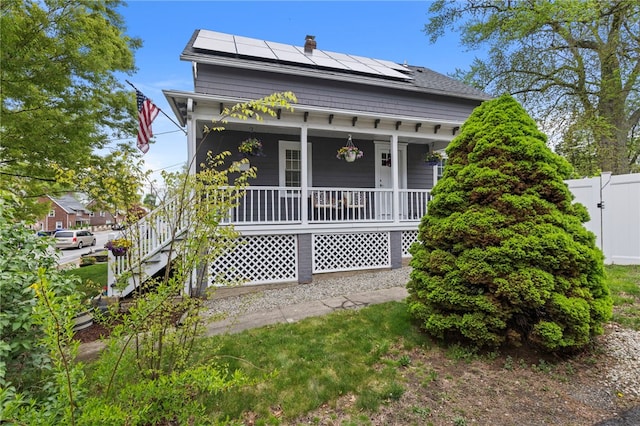 229 Roger Williams Ave, East Providence, RI 02916 - view of front of house with roof mounted solar panels and covered porch