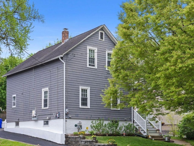 229 Roger Williams Ave, East Providence, RI 02916 - view of home's exterior featuring a chimney