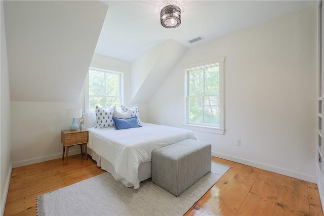 26 Old Stone Church Rd, Little Compton, RI 02837 - bedroom with light wood finished floors and lofted ceiling