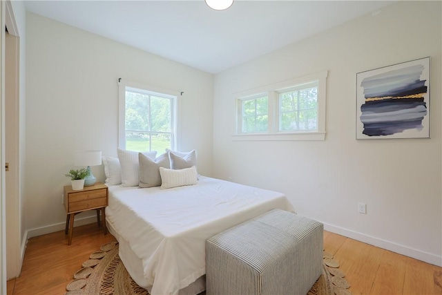 26 Old Stone Church Rd, Little Compton, RI 02837 - bedroom with light wood-type flooring and baseboards