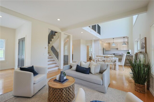 26 Old Stone Church Rd, Little Compton, RI 02837 - living area featuring light wood-type flooring, stairway, and recessed lighting
