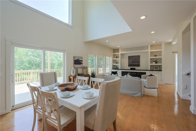 26 Old Stone Church Rd, Little Compton, RI 02837 - dining space with healthy amount of natural light, light wood-style floors, recessed lighting, and built in shelves
