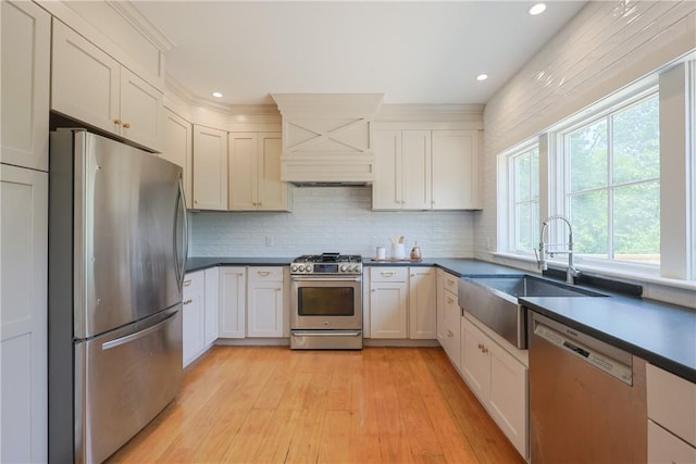 26 Old Stone Church Rd, Little Compton, RI 02837 - kitchen featuring stainless steel appliances, custom range hood, light wood finished floors, decorative backsplash, and recessed lighting