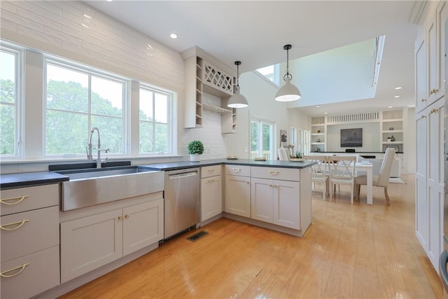 26 Old Stone Church Rd, Little Compton, RI 02837 - kitchen with dishwasher, dark countertops, light wood-style flooring, pendant lighting, and open shelves
