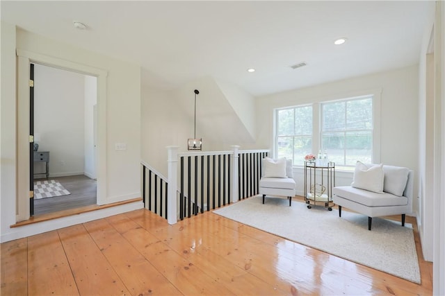 26 Old Stone Church Rd, Little Compton, RI 02837 - sitting room with an upstairs landing, wood finished floors, and recessed lighting