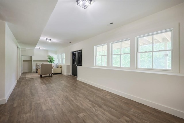 26 Old Stone Church Rd, Little Compton, RI 02837 - unfurnished living room with baseboards and wood finished floors