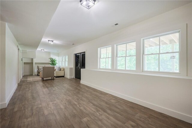 26 Old Stone Church Rd, Little Compton, RI 02837 - unfurnished living room with baseboards and wood finished floors