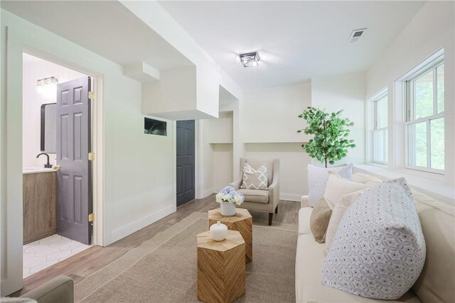 26 Old Stone Church Rd, Little Compton, RI 02837 - living area with light wood-type flooring and built in features