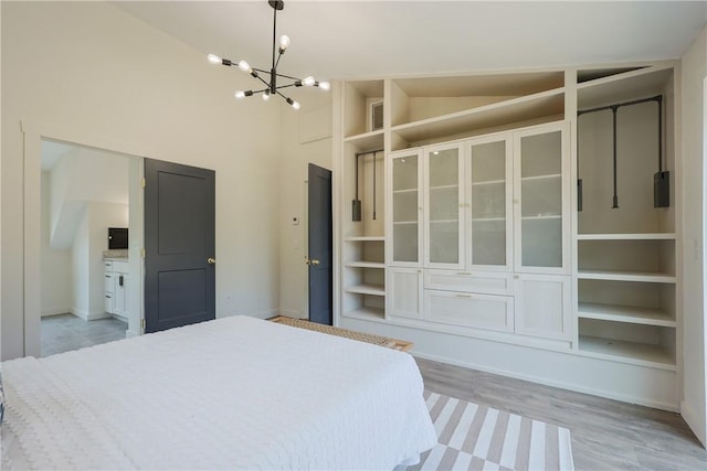 26 Old Stone Church Rd, Little Compton, RI 02837 - unfurnished bedroom with a chandelier, light wood-style flooring, and high vaulted ceiling