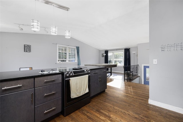 94 Waterman Ave, Warwick, RI 02889 - kitchen with black range with electric stovetop, dark wood-type flooring, vaulted ceiling, dark countertops, and decorative light fixtures