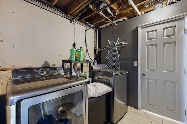 94 Waterman Ave, Warwick, RI 02889 - washroom with washer and dryer and light tile patterned floors