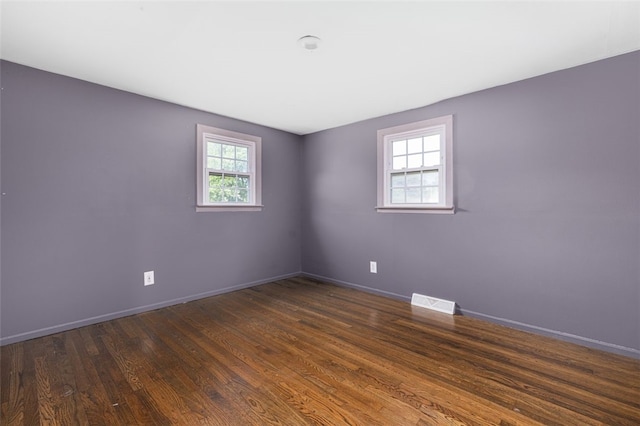94 Waterman Ave, Warwick, RI 02889 - unfurnished room featuring baseboards and dark wood-style flooring