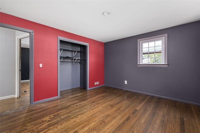 94 Waterman Ave, Warwick, RI 02889 - unfurnished bedroom featuring wood finished floors and a closet