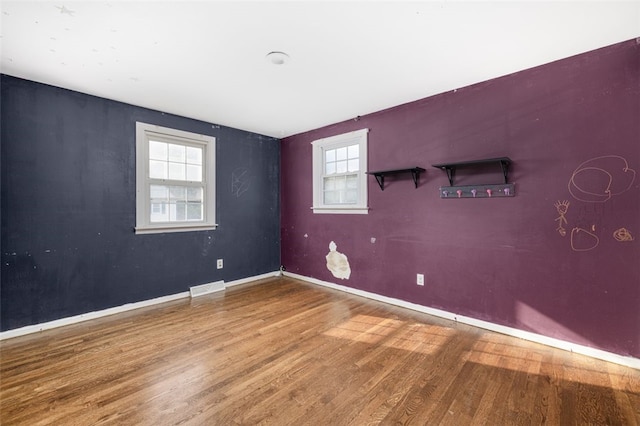 94 Waterman Ave, Warwick, RI 02889 - spare room with wood finished floors and baseboards