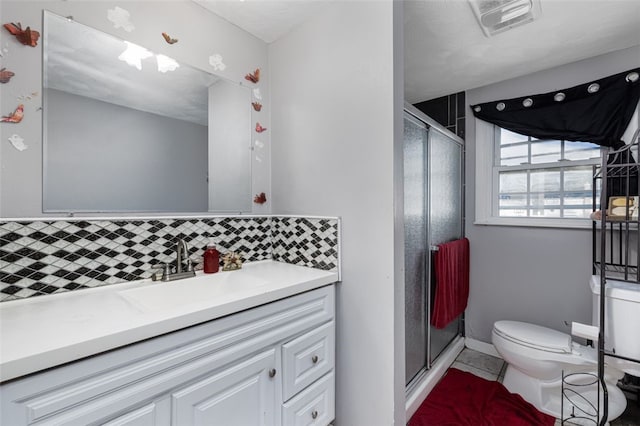 94 Waterman Ave, Warwick, RI 02889 - bathroom featuring decorative backsplash, vanity, a shower stall, and tile patterned floors