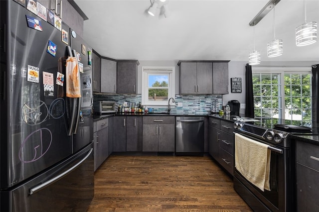 94 Waterman Ave, Warwick, RI 02889 - kitchen with black appliances, dark countertops, decorative backsplash, and dark wood-style flooring