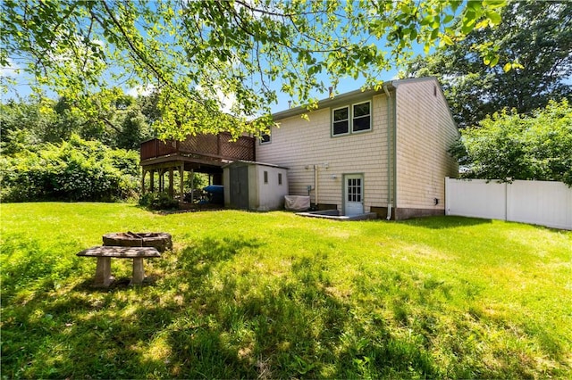 11 Tupelo Trl, Narragansett, RI 02882 - back of house with an outdoor fire pit, a wooden deck, and a shed