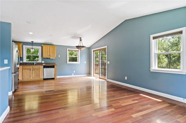 11 Tupelo Trl, Narragansett, RI 02882 - kitchen featuring stainless steel appliances, light wood-style flooring, lofted ceiling, and hanging light fixtures