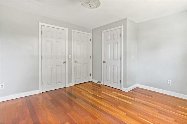 11 Tupelo Trl, Narragansett, RI 02882 - unfurnished bedroom with baseboards and wood finished floors