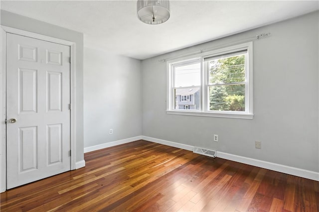 11 Tupelo Trl, Narragansett, RI 02882 - unfurnished bedroom with baseboards and wood finished floors