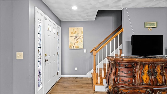 26 Grafton St Unit 3, Providence, RI 02904 - foyer featuring wood finished floors, stairway, and recessed lighting